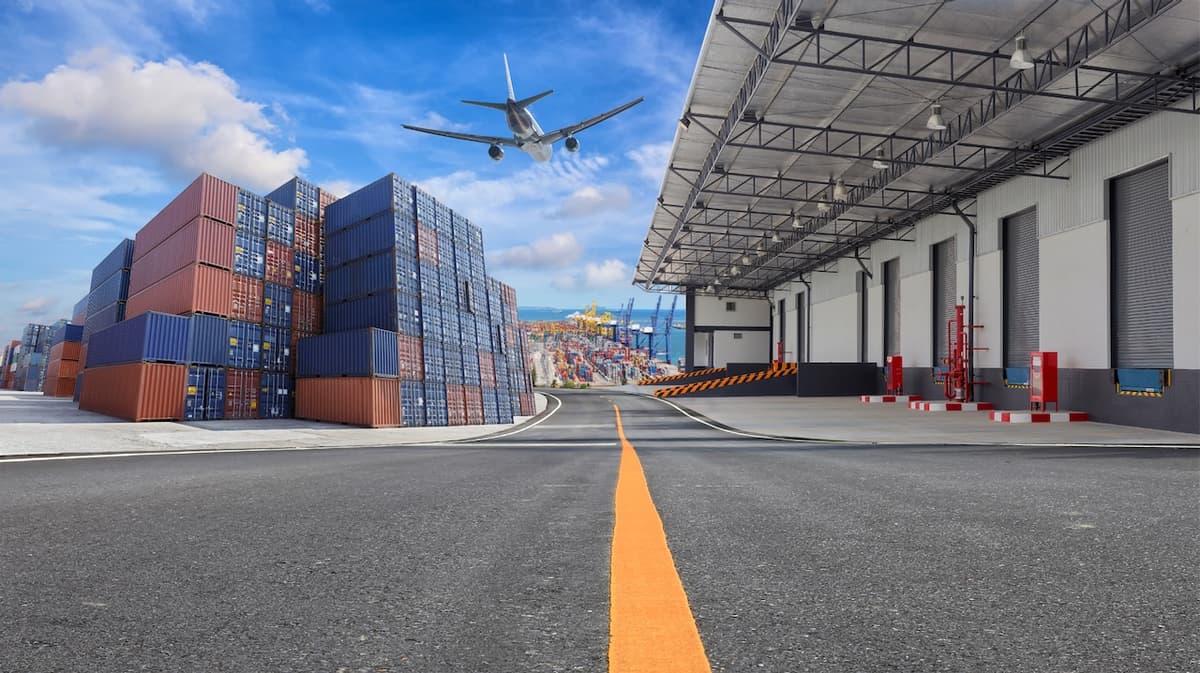 Stacked containers and a plane taking off at a port, symbolizing the integration of air and maritime transport in Del Bravo's global logistics operations