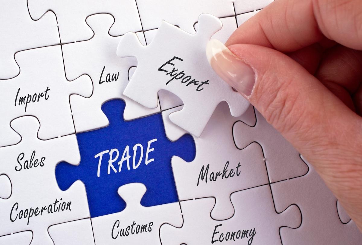 Puzzle pieces with international trade terms, highlighting Del Bravo's expertise in export and global trade