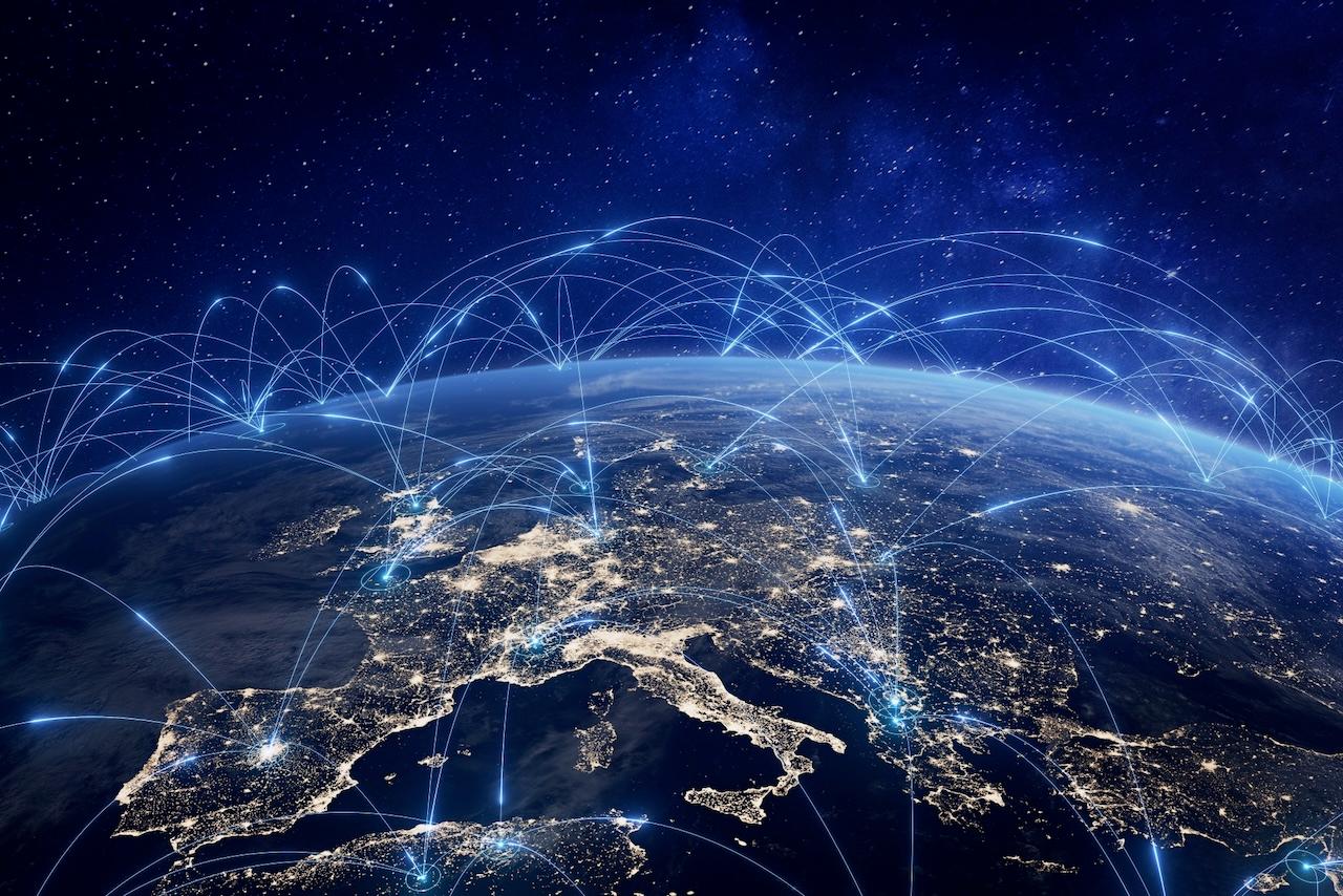 Illuminated global network connections over a nighttime map of Europe, highlighting Del Bravo's extensive international network in global logistics