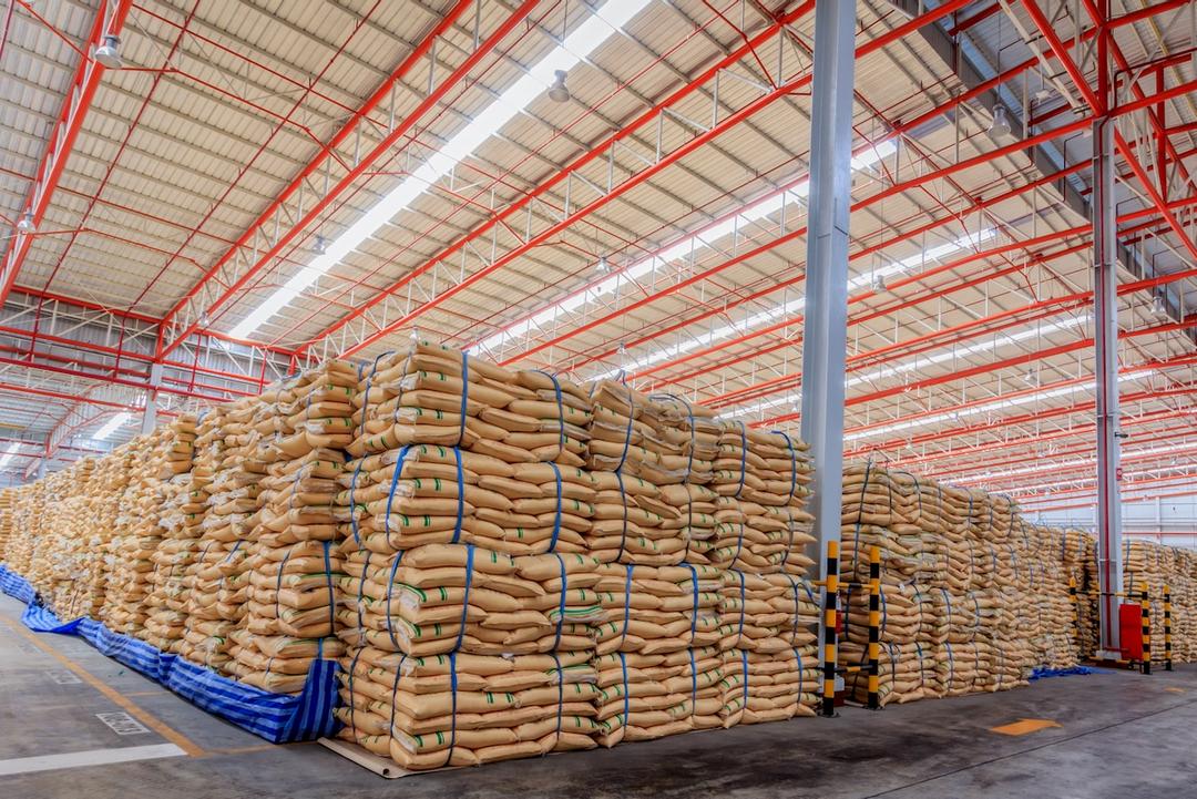 Warehouse with large stacked sacks of goods, representing storage efficiency