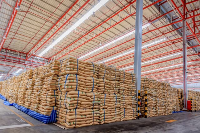 Warehouse with large sacks of merchandise stacked, symbolizing storage efficiency