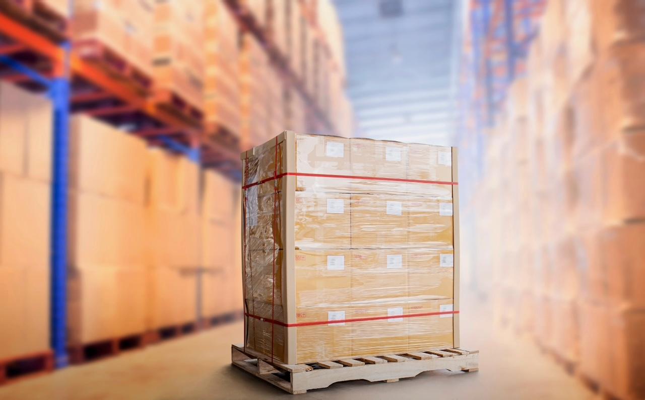 Pallet with perfectly packaged goods in a warehouse, representing the careful and organized handling of products within Del Bravo's facilities