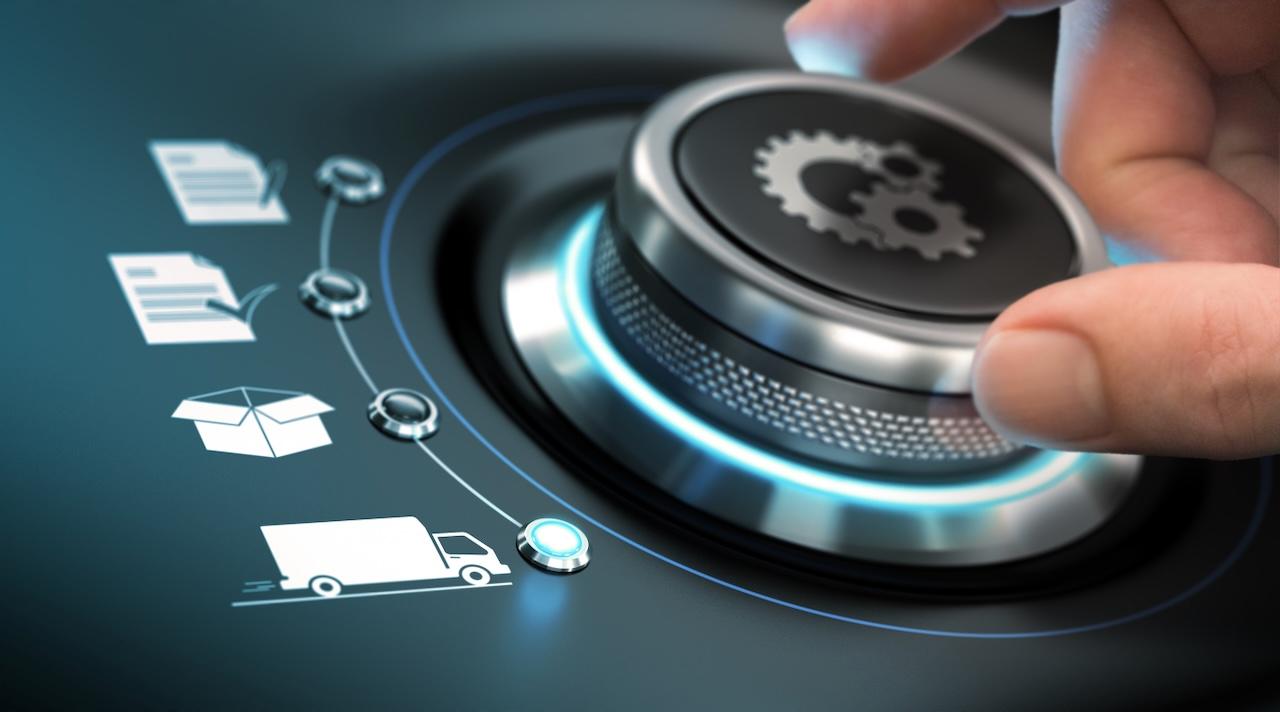 Hand adjusting a dial with logistics icons, representing the process optimization and supply chain efficiency provided by Del Bravo